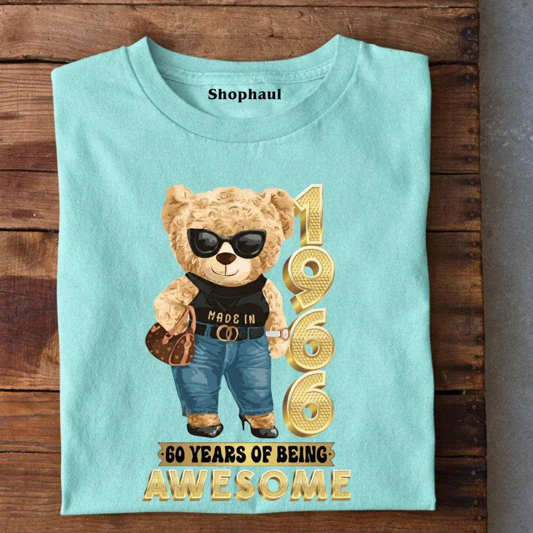 Aqua blue t-shirt with a stylish teddy bear graphic, '1966' and '60 years of being awesome' print.
