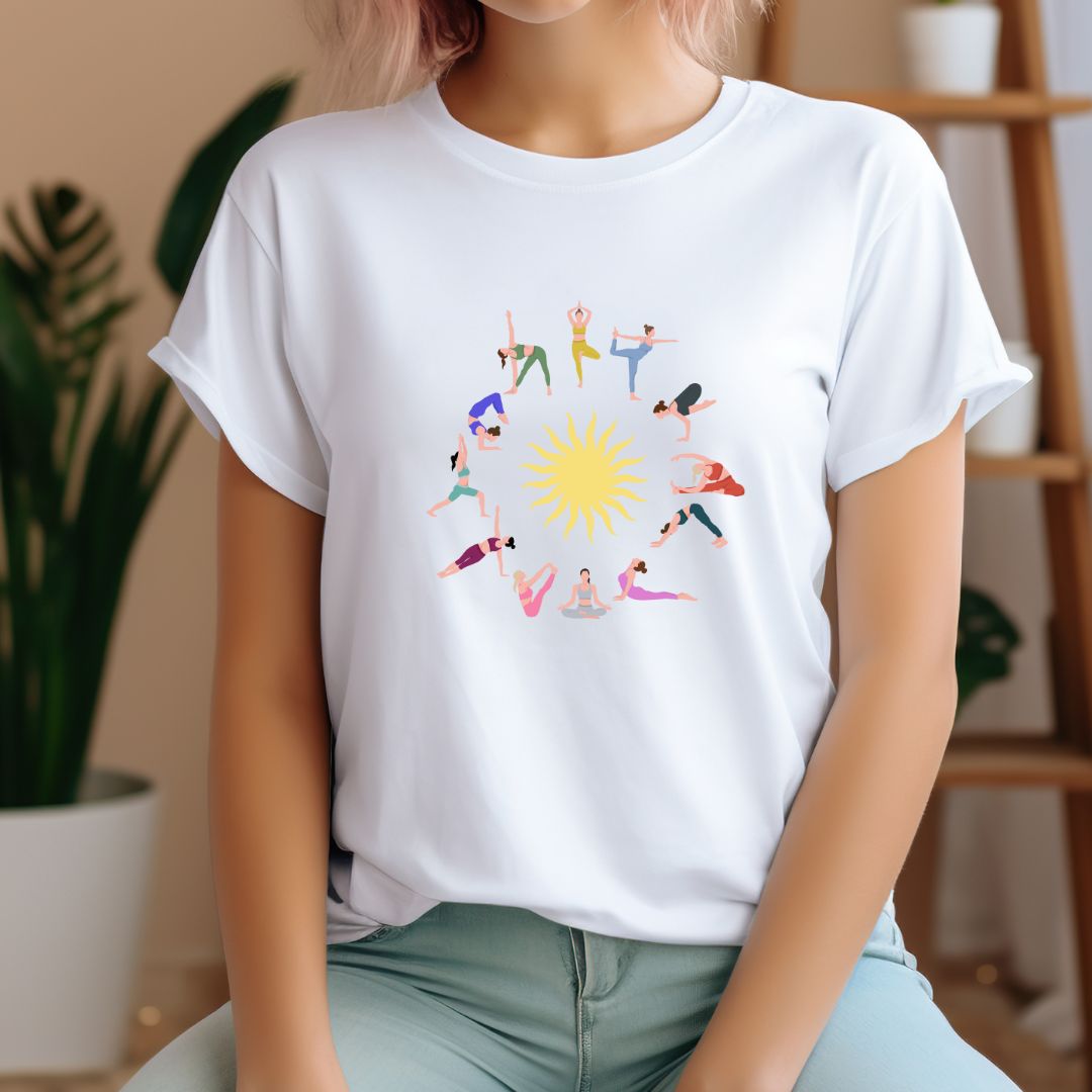 White t-shirt with colorful Surya Namaskar yoga poses arranged in a circle around a yellow sun graphic