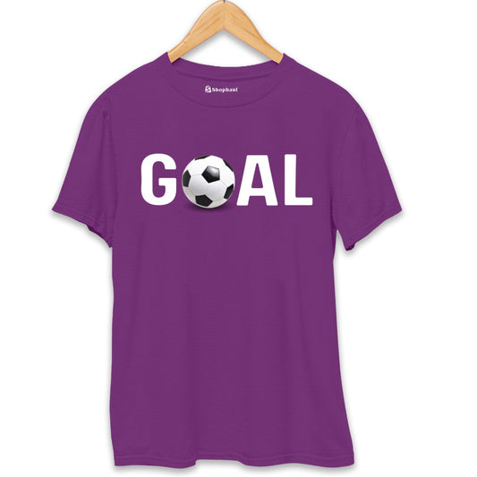 Purple t-shirt with GOAL text and a soccer ball graphic, hung on wooden hanger