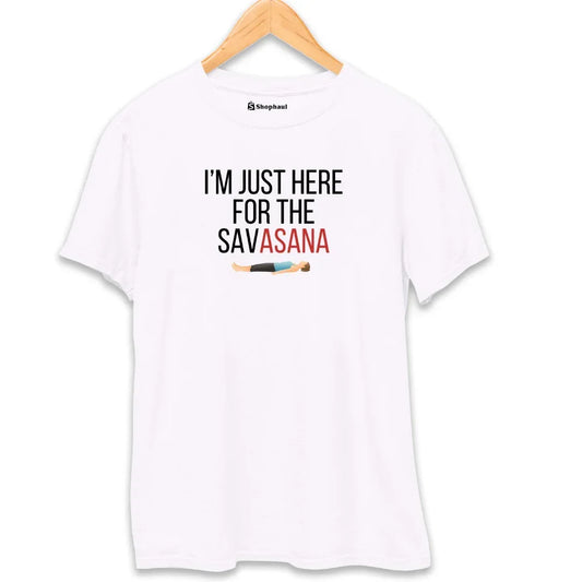 White unisex t-shirt with printed text 'I'm just here for the savasana' and yoga pose graphic