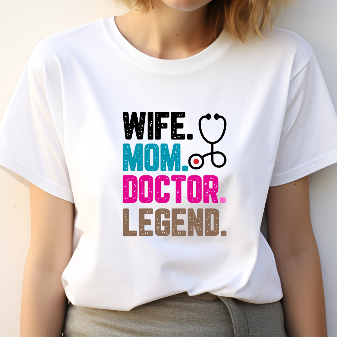White t-shirt with colorful text wife mom doctor legend and a stethoscope graphic