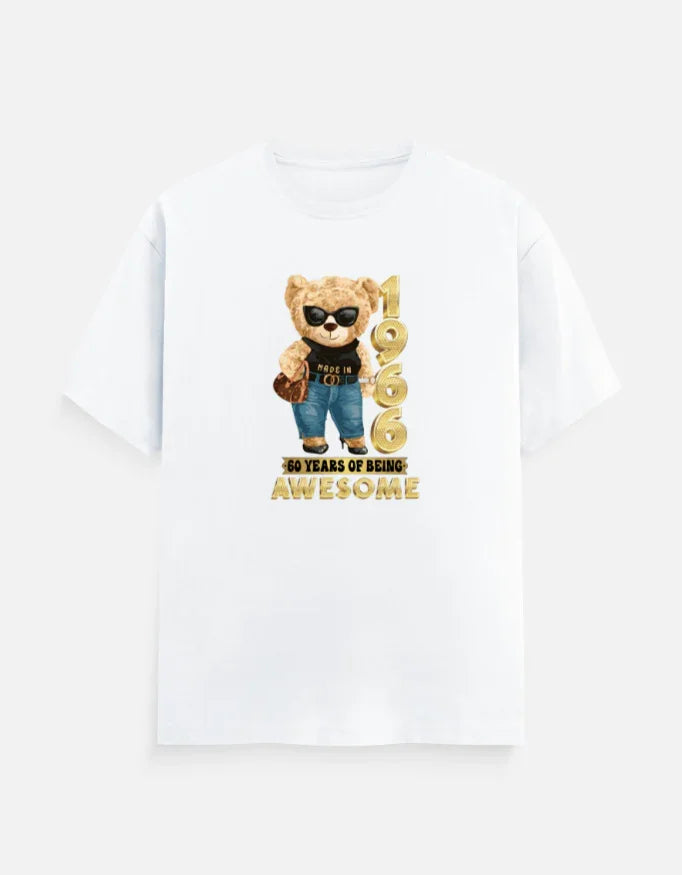 White printed t-shirt with a teddy bear, gold '1966', and '60 years of being awesome' text.