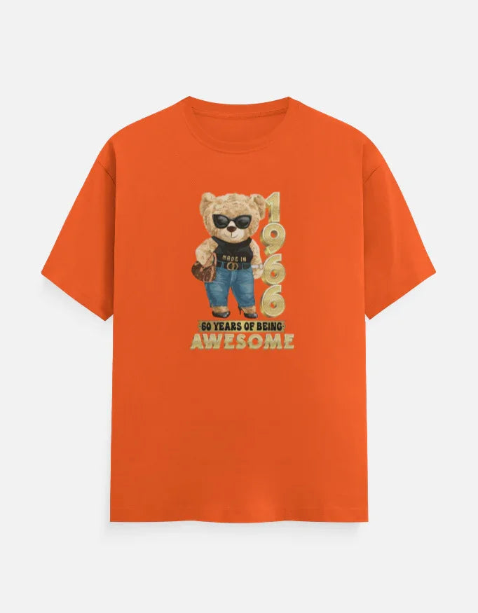 Orange printed t-shirt with bear graphic, '1966' text, and '60 years of being awesome' slogan.