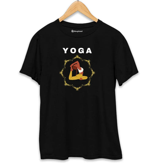 Black t-shirt with yoga pose graphic and yellow ornamental frame, hung on a wooden hanger