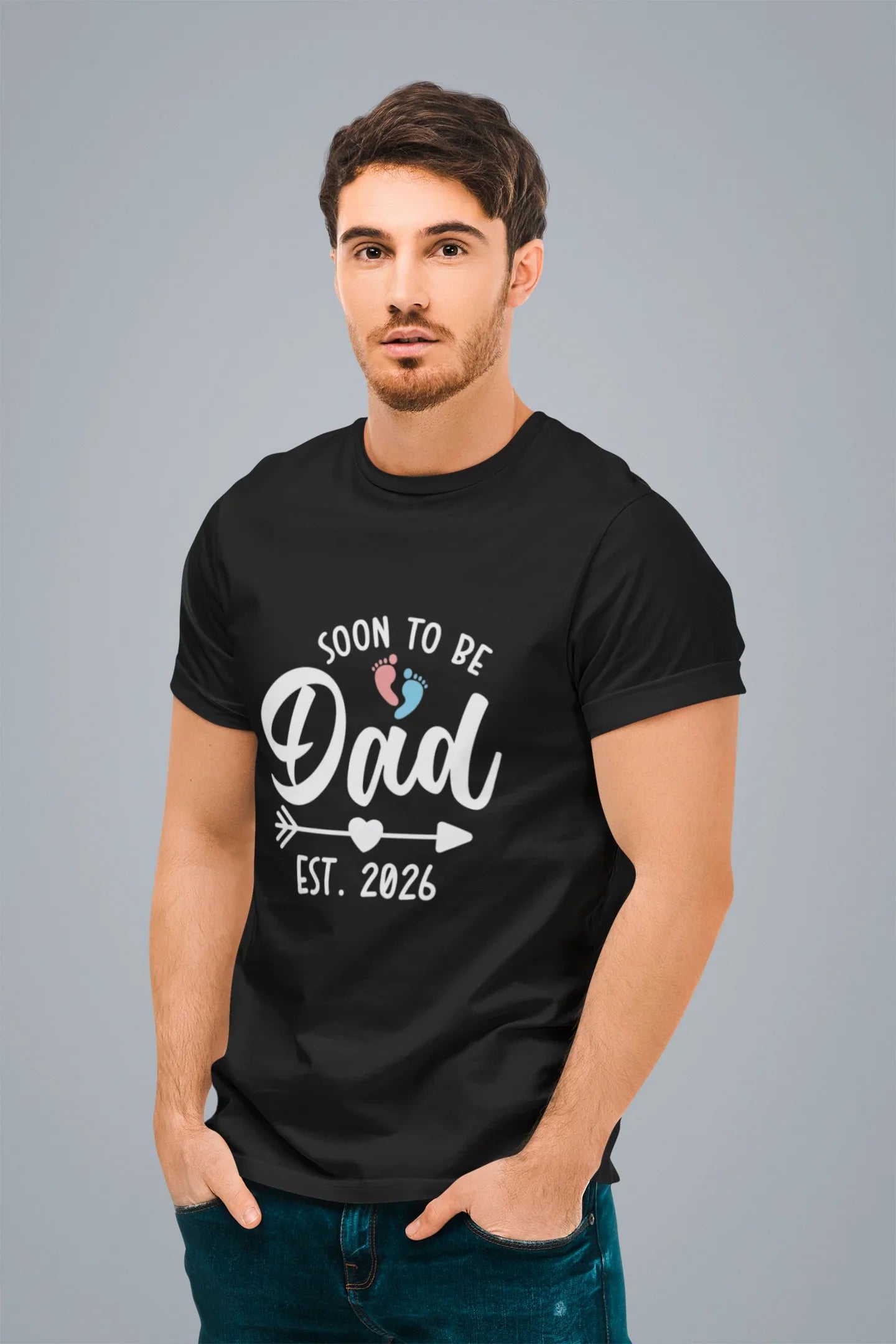 Man wearing a black t-shirt with 'Soon to be Dad' text on a gray background